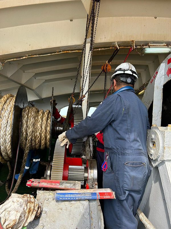 Workers Working on Machinery image