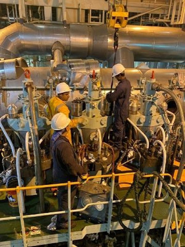 Workers Working on Machinery image