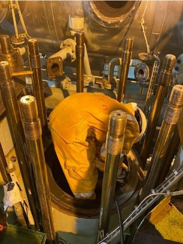 Workers Working on Machinery image