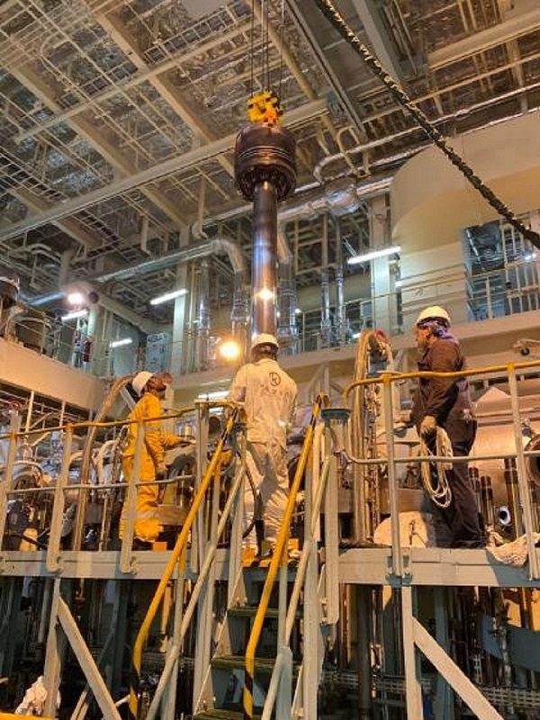 Workers Working on Machinery image